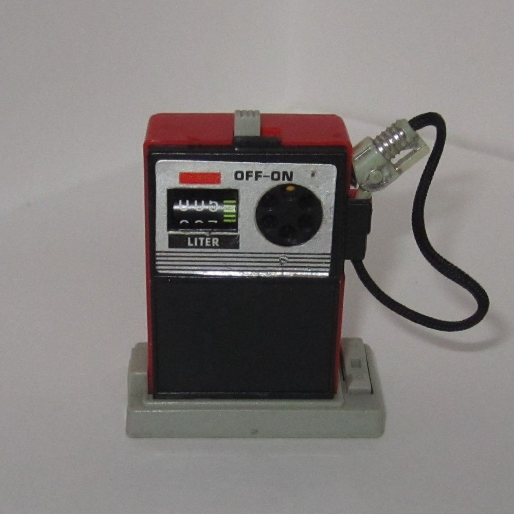 Vintage Tomy Wind-Up Gas Pump with Car Launcher
